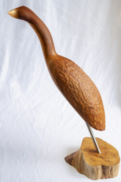 Wood carving sculpture of bird with steel and wood base